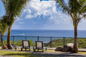 Two relaxing chairs in front of a beautiful sea view